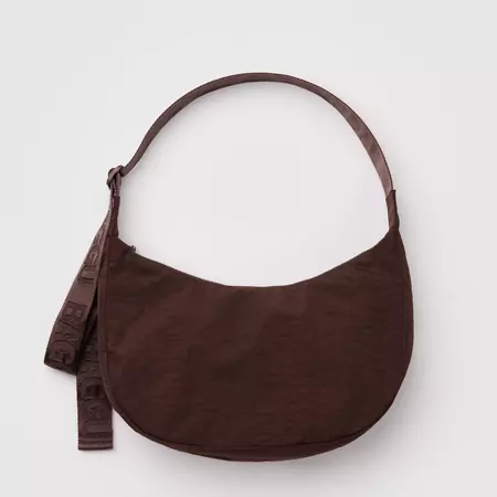 A brown purse with a round strap