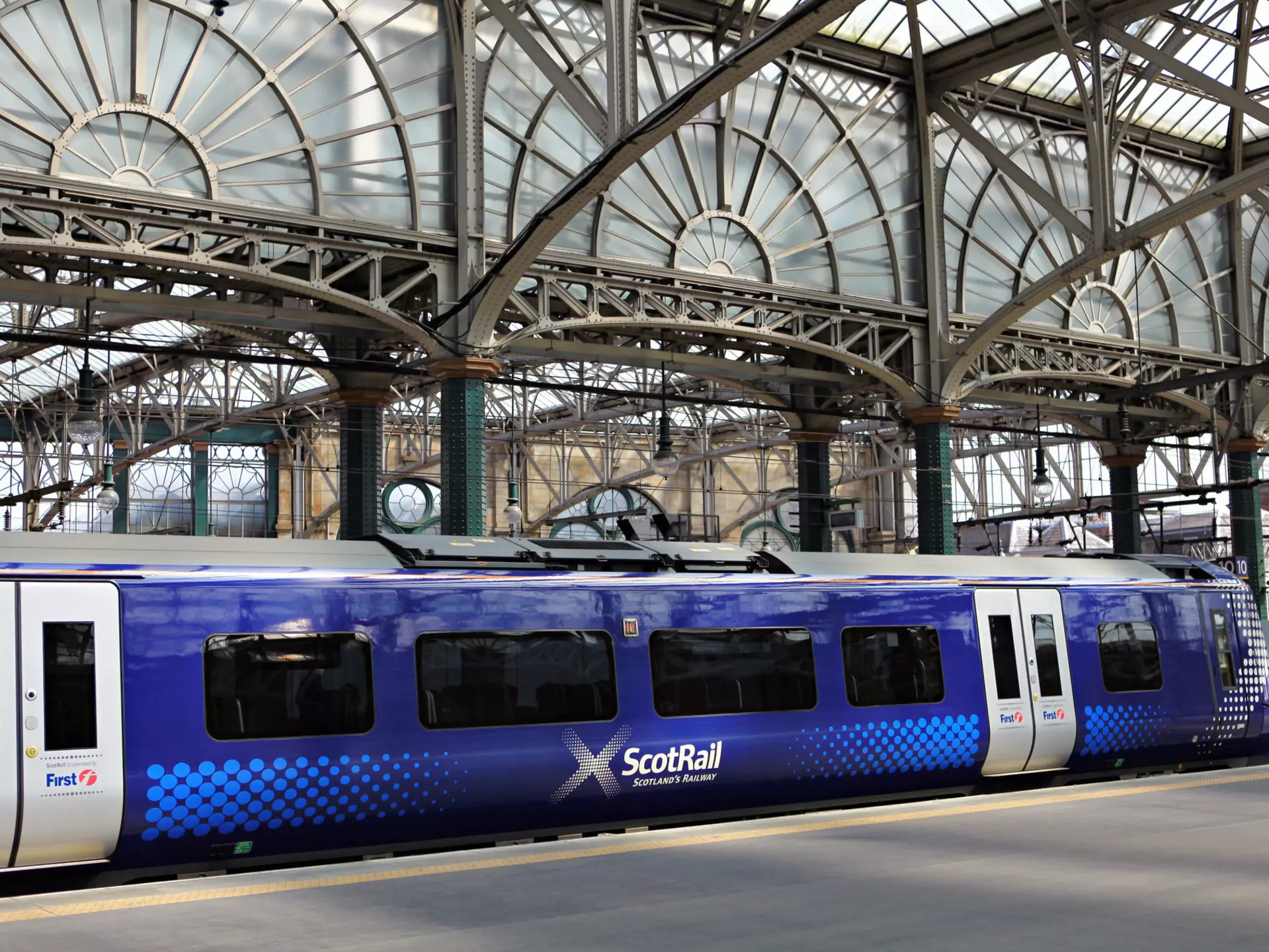GLASGOW, SCOTLAND, UK - JULY 12, 2013: A ScotRail train at the platform at Queen Street station in Glasgow. Glasgow Central Station was opened on 31 July 1879.
arch, architecture, building, center, central, city, entrance, facade, glasgow, house, lines, mainline, old, people, platform, queen, railway, red, scotland, scotrail, scottish, sign, signal, station, street, tower, tracks, train, view, way