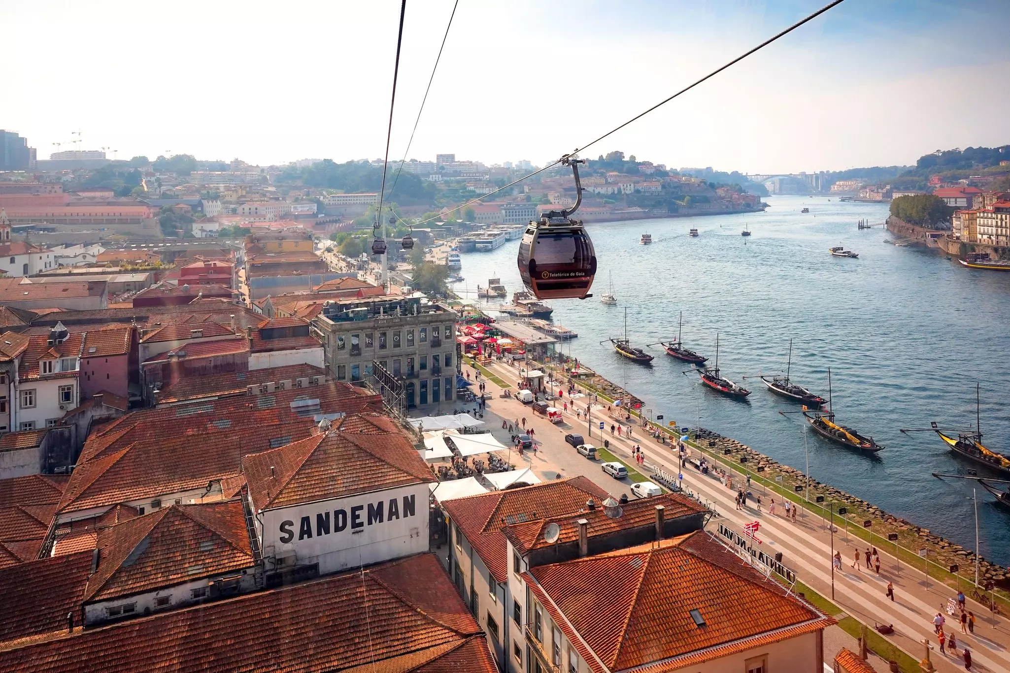  Aerial view of Porto from the cable car in Porto, Portugal. View on Vila nova de gaia with it's famous port wine houses. Boats are in the water