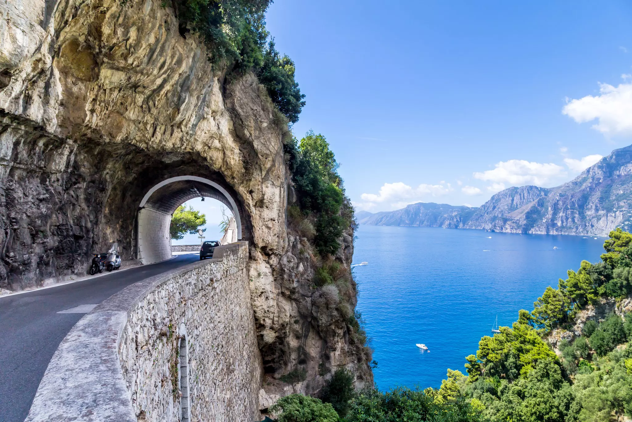 A road tunnel along the Amalfi Coast with a view of the sea, Campania, Italy.