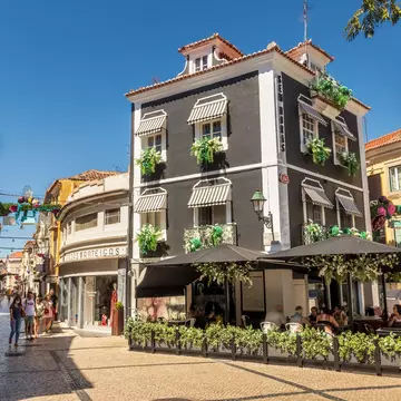 Setúbal, Portugal - August 28, 2020: In downtown Setúbal we find a large part of traditional commerce, where world brands join other older ones, as well as bars and restaurants as in the case of the building depicted in which a restaurant bar operates.