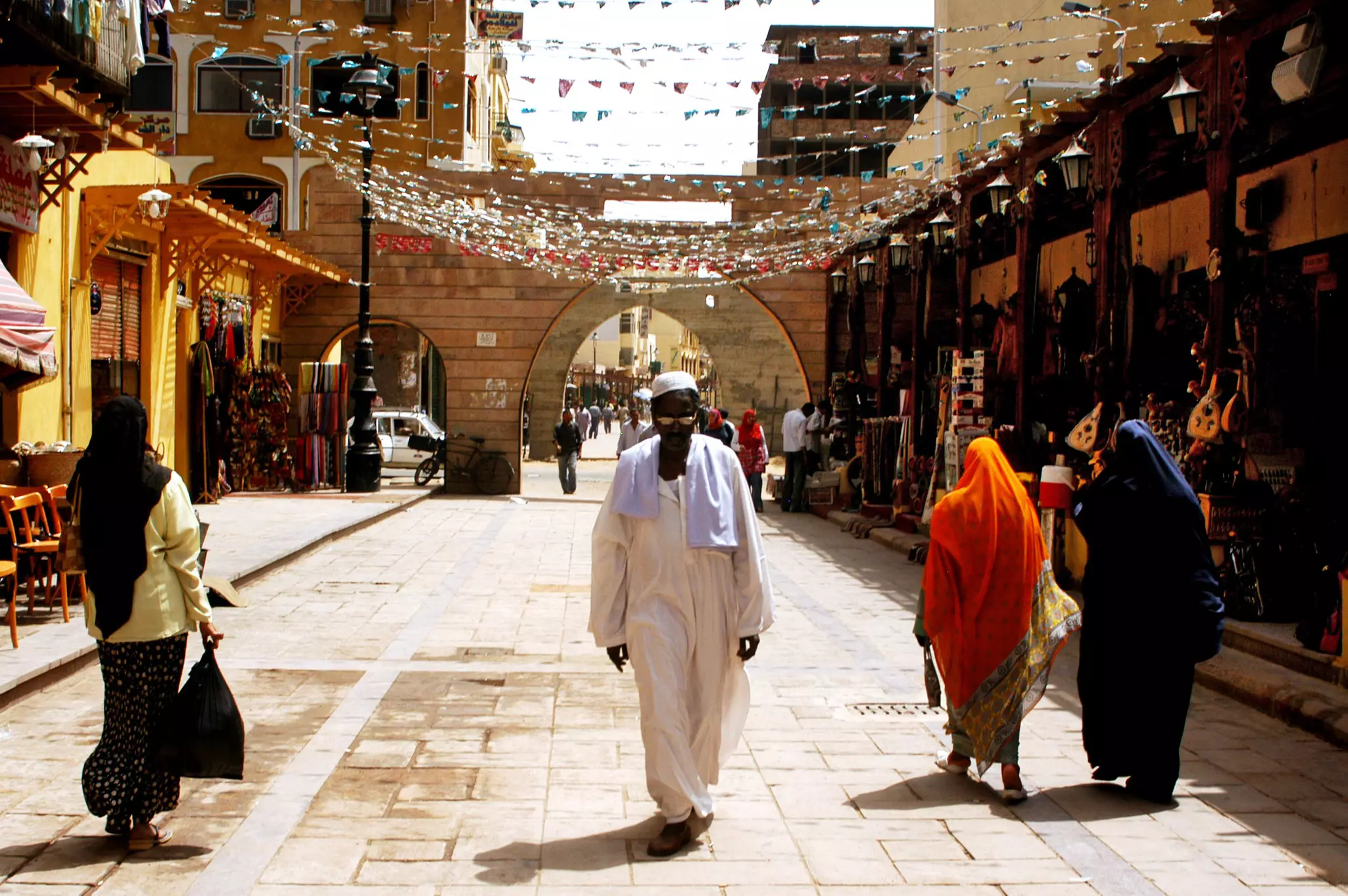 ASWAN - APRIL 28 2007:Egyptian people shopping in the market of Aswan city in Southern Egypt. Aswan is one of the driest inhabited places in the world.  License Type: media  Download Time: 2023-07-12T06:50:25.000Z  User: aomi.ito_lonelyplanet  Is Editorial: Yes  purchase_order: