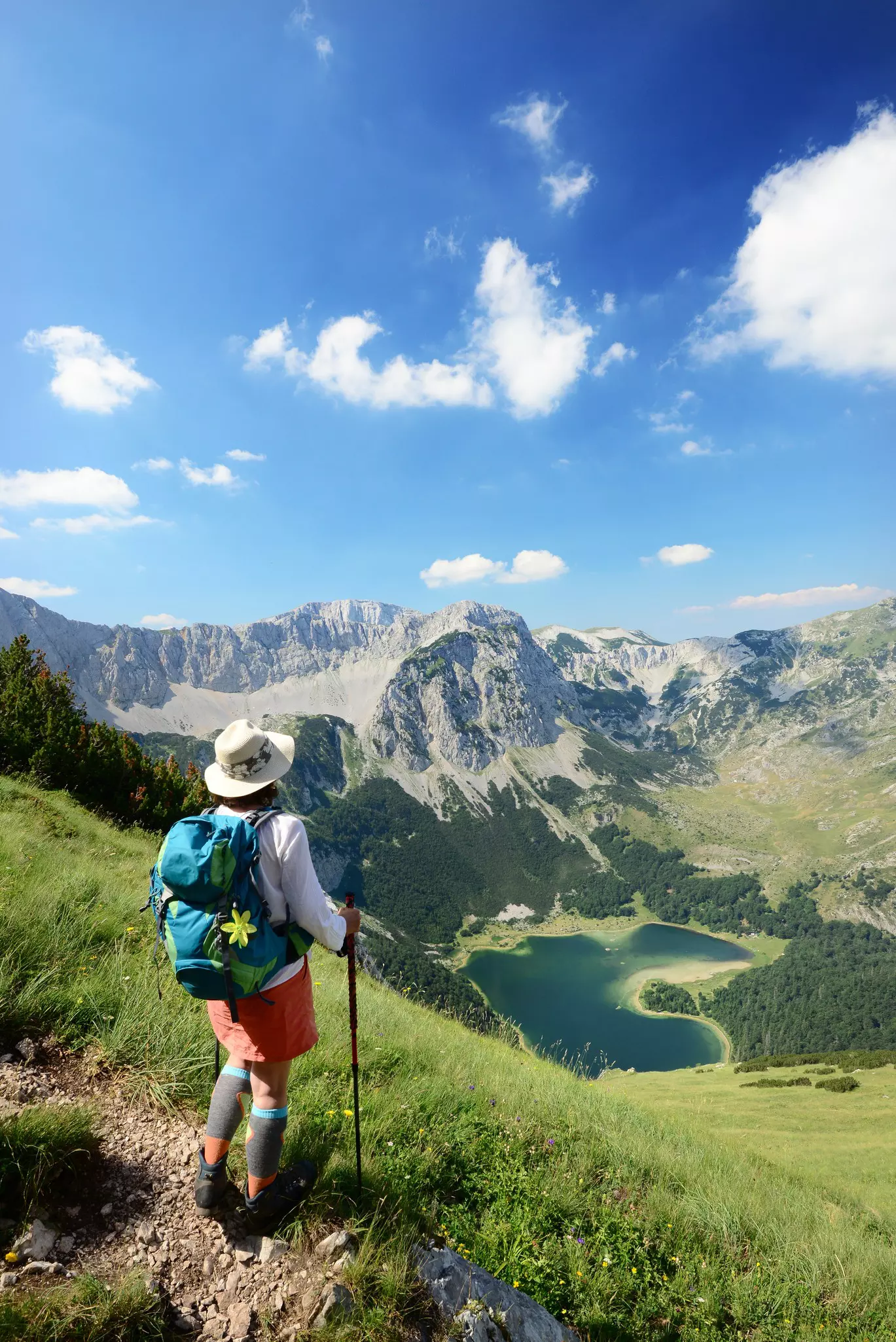 A hiker looking down on Trnovačko Lake, Montenegro