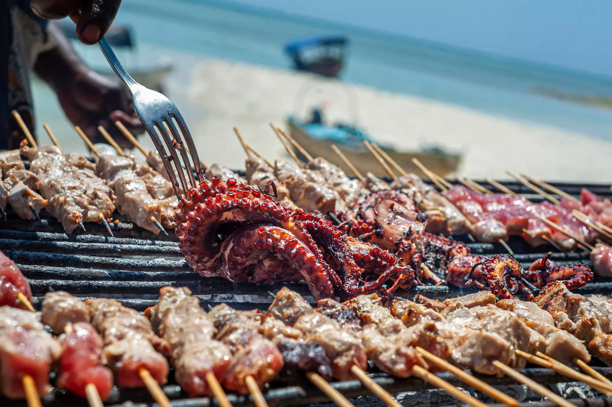 Dine on freshly caught seafood when traveling along the coast for a tasty budget meal © Denys R / Shutterstock