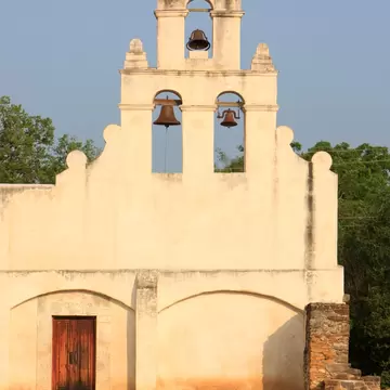 This landmark image depicts Mission San Juan Capistrano in San Antonio, Texas. This UNESCO World Heritage Site was established in 1731 by Spanish colonist along the banks of the San Antonio River.