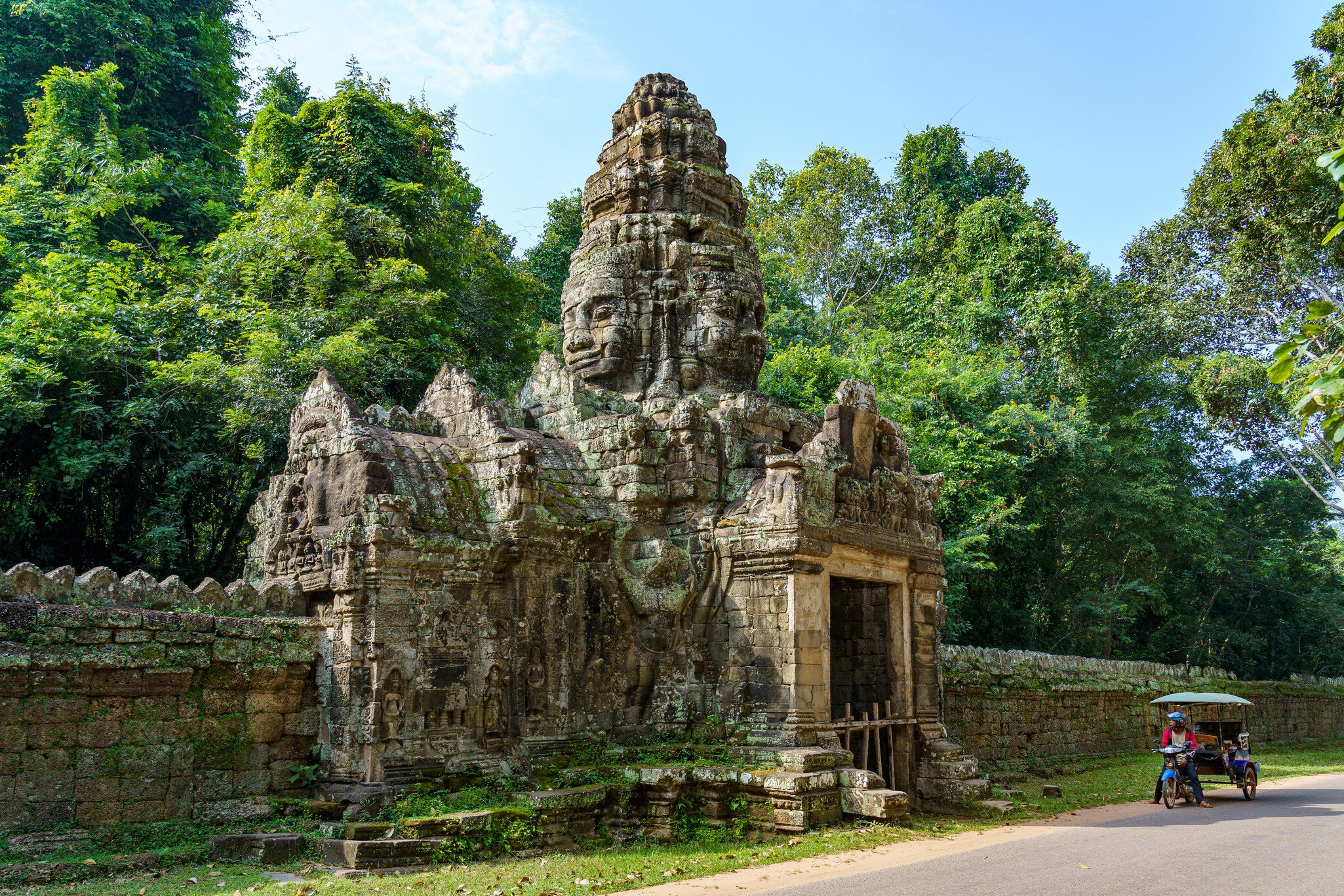 Cambodia. Siem Reap Province. The archaeological park of Angkor. A Buddha sculpture of a north gate of Banteay Kdei temple