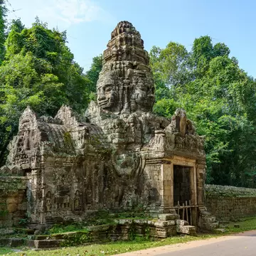 Cambodia. Siem Reap Province. The archaeological park of Angkor. A Buddha sculpture of a north gate of Banteay Kdei temple