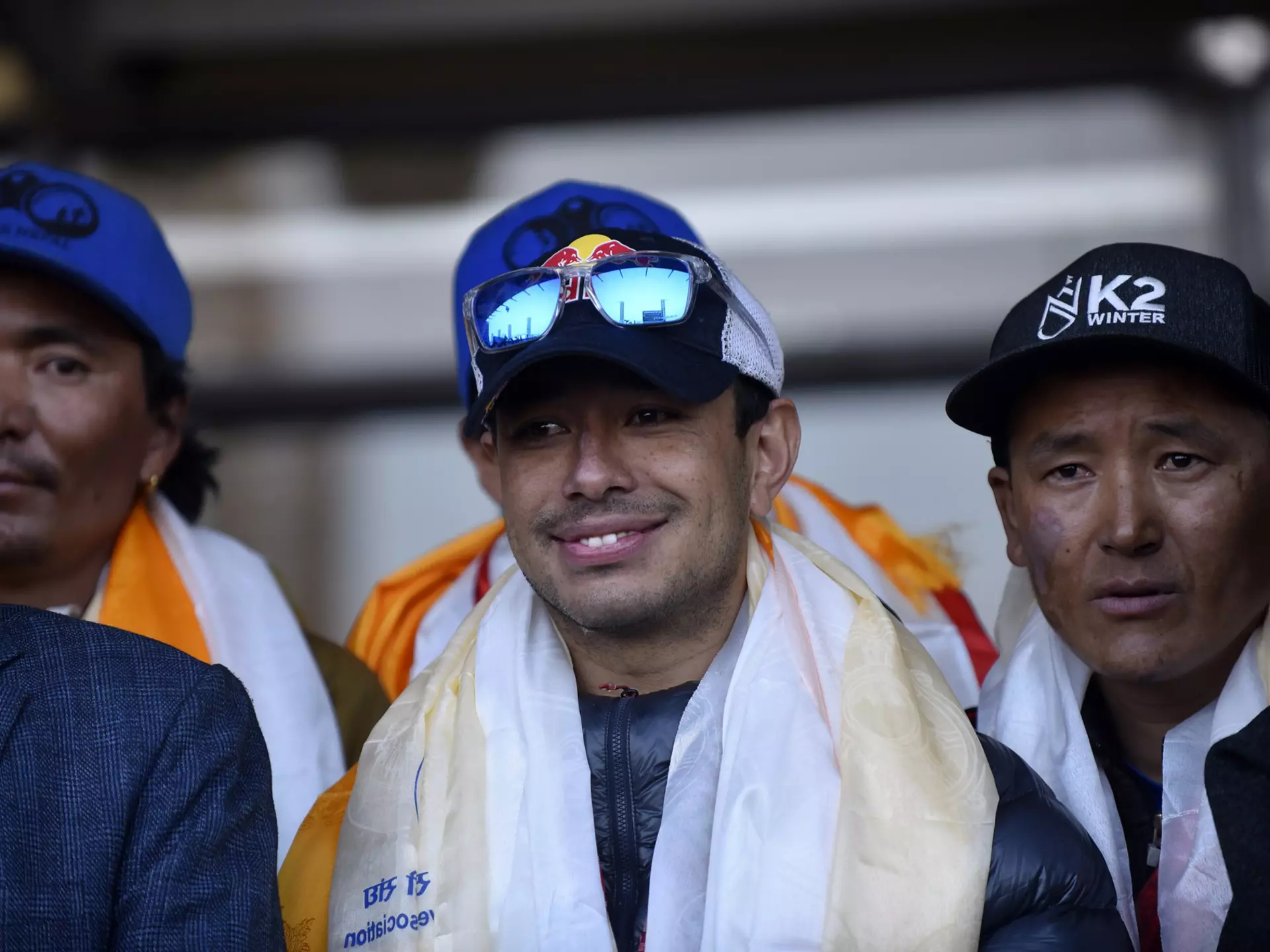 Nirmal Purja along the team member of Nepalese mountaineering team arrive and greet towards people after the first to scale Mount K2 in winter cheer as they arrive at Tribhuwan International airport in Kathmandu, Nepal, Tuesday, January 26, 2021. (Photo by Narayan Maharjan/NurPhoto via Getty Images)
1230803978
k2, mount k2, nepalese mountaineering team, nepalese mountaineering, mountaineering, k2 winter, k2 in winter, first to scale mount k2, welcome home, hero's welcome, nepal tourism, mountains, cheer, happy, moment, friends, relatives, rituals, offering, nepal pakistan, nepal-pakistan, narayan, maharjan, maharjansphotography, narayanmaharjan, maharjanarayan