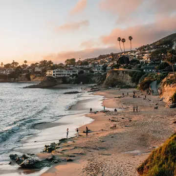View of beach and cliffs at sunset, in Laguna Beach, Orange County, California, License Type: media, Download Time: 2025-08-04T20:29:27.000Z, User: meg3348277, Editorial: false, purchase_order: 56530 - Guidebooks, job: Global Publishing-WIP, client: Lonely Planet 'California 11, other: Megan Cassidy