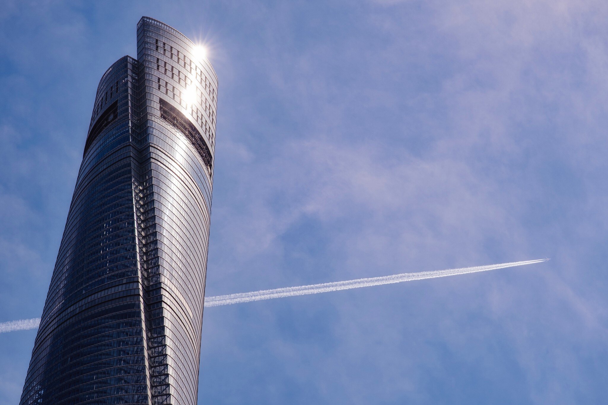 View of the gleaming Shanghai Tower on a sunny day in Shanghai, China.
