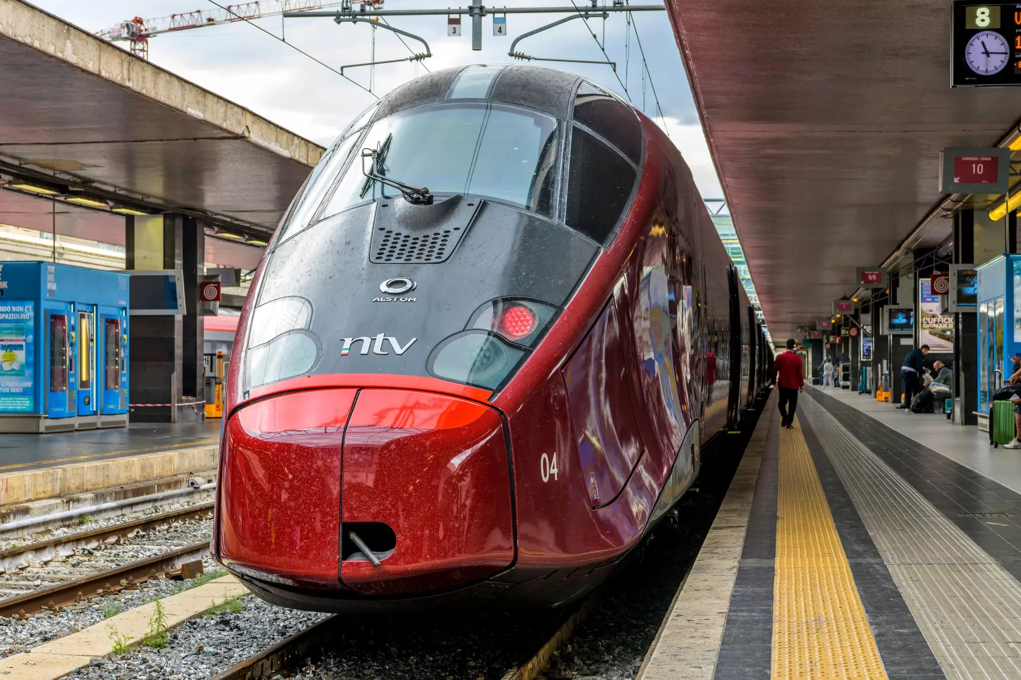 A red Italian high-speed train in Rome Termini train station, Rome, Italy.