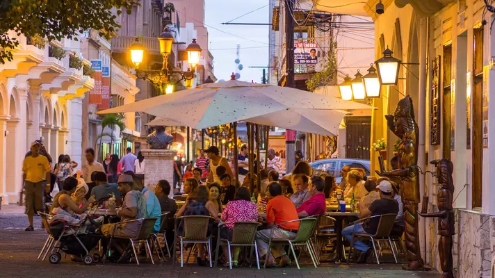 Santo Domingo, Dominican Republic - February 23, 2013: People enjoy the early hours of the evening at a street side cafe in the Zona Colonial or historical district of Santo Domingo. The pedestrian district can be seen in the background.
459260719
Editorial, Sidewalk Cafe, Photography, Santo Domingo - Mexico, Dusk, Twilight, Color Image, Old Town, Eating, Colonial Style, Travel Destinations, Outdoors, People, Central America, North America, Dominican Republic, Night, Bar - Drink Establishment, Cafe, Restaurant
Street cafes Santo Domingo, Dominican Republic