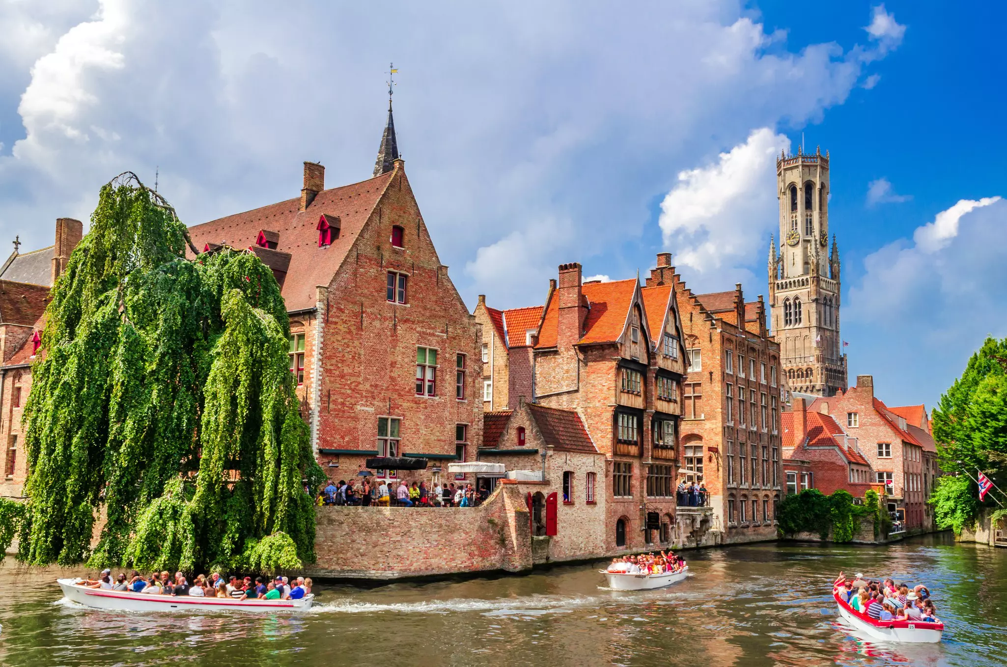 Tourist boats and blue skies at Rosary Quay (Rozenhoedkaii), Bruges