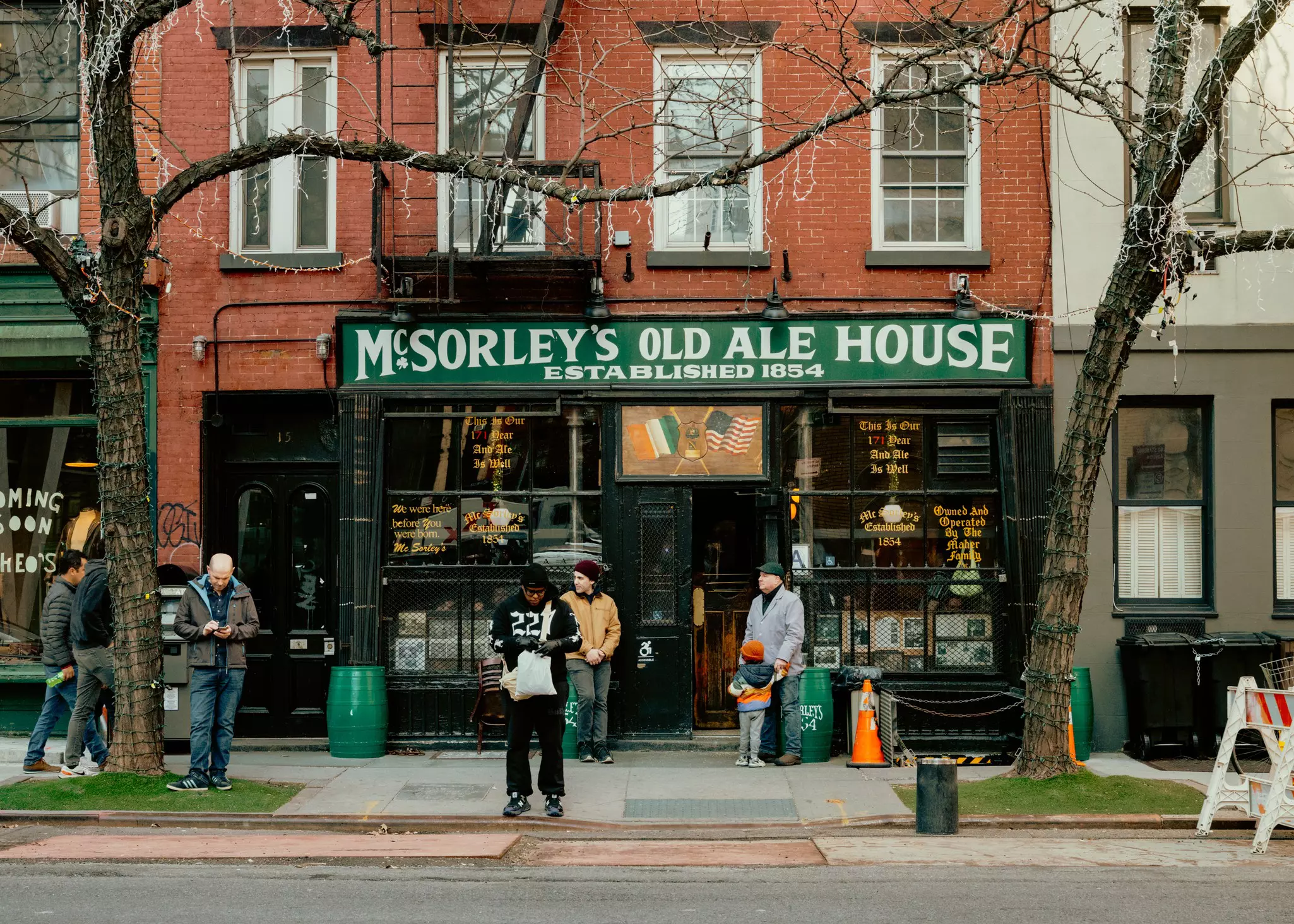People outside McSorley's Old Ale House in East Village, Manhattan, New York