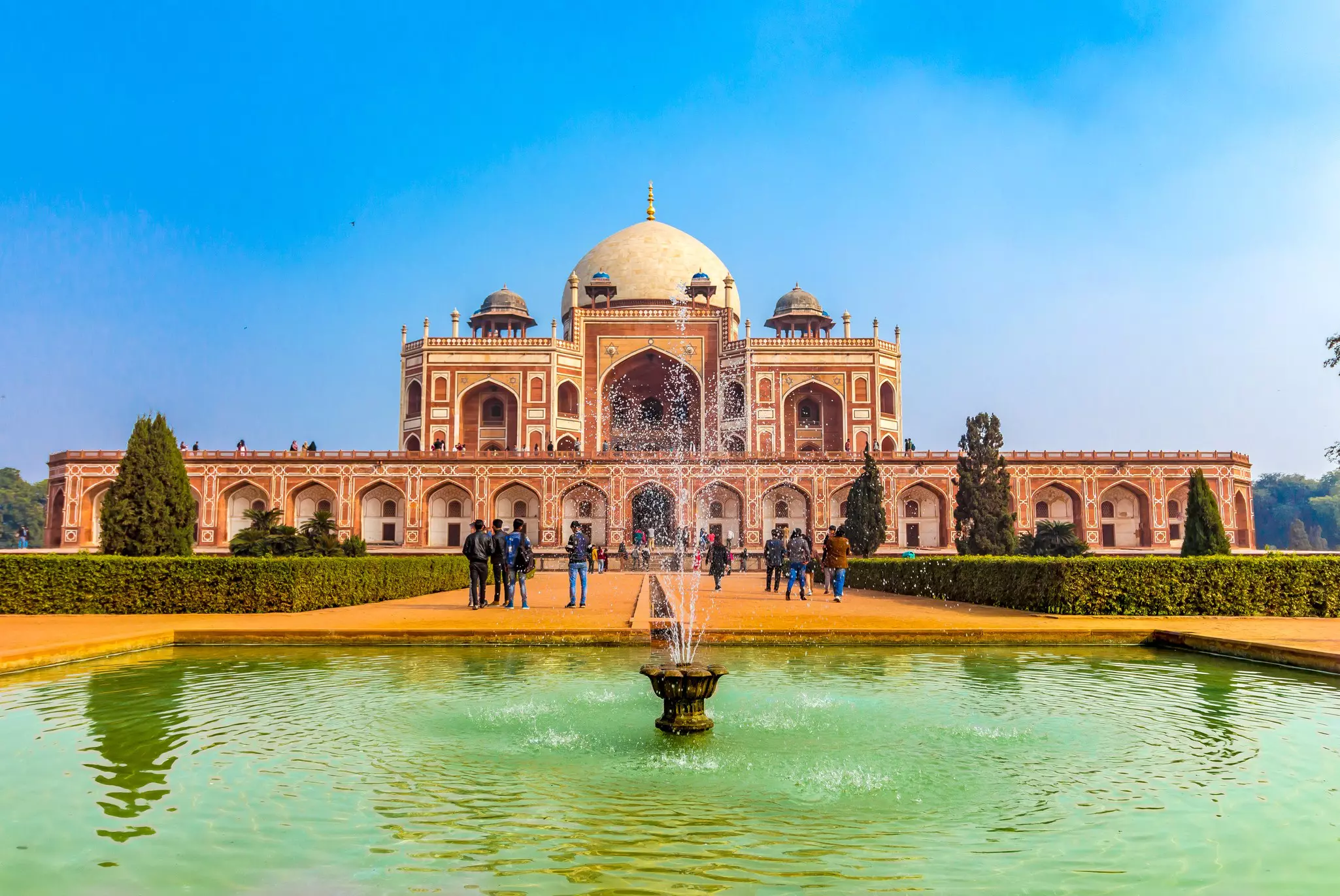 Exterior of Humayun's Tomb with a small fountain in the foreground in Delhi