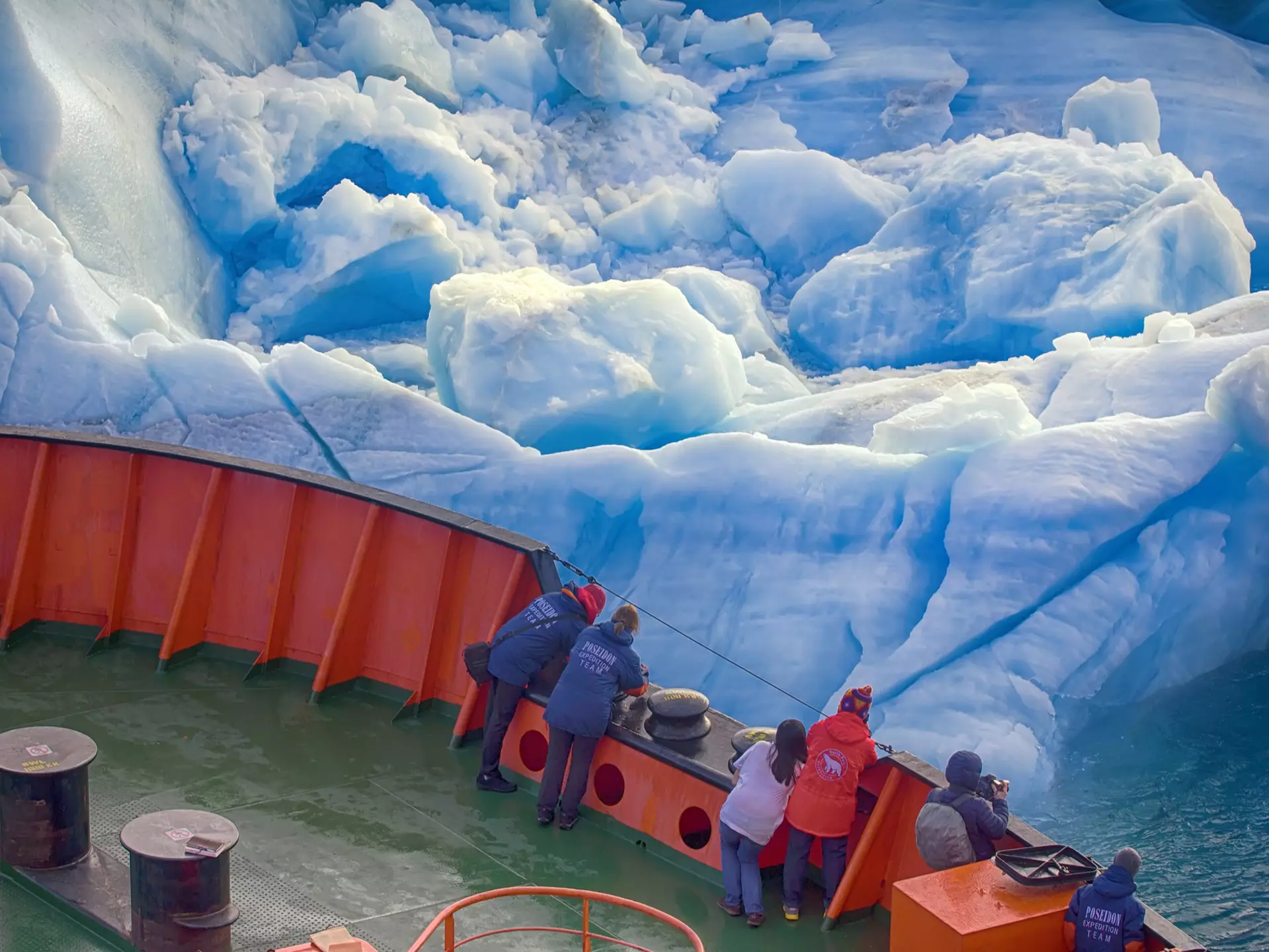 Franz Joseph Land - 10 July 2016: Tourist cruise in high Arctic. Ship sails close to small iceberg. But we should remember that 90% of ice mountain is under water. Titanic Iceberg was a little more, License Type: media, Download Time: 2025-05-28T09:54:09.000Z, User: lonelyplanetmedia, Editorial: true, purchase_order: 65050 - Digital Destinations and Articles, job: Global Publishing WIP, client: Global Publishing WIP, other: Peterson Haggarty // SS Comp Ingestion