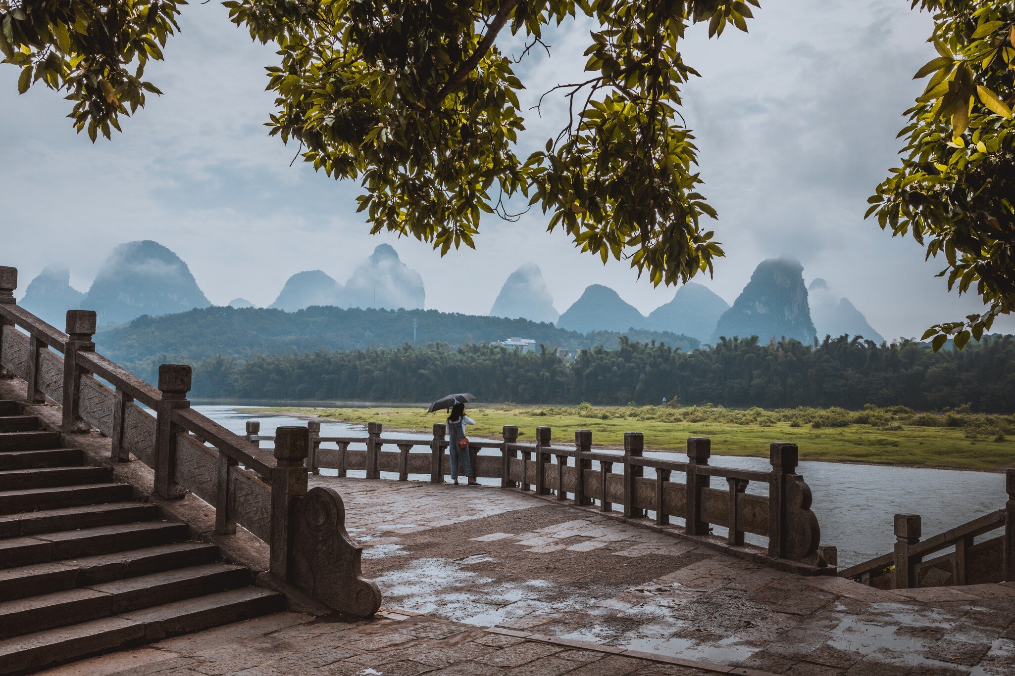 GettyImages-1033382930.jpg
Scenic landscape at Yangshuo County of Guilin, China. View of beautiful karst mountains and the Li River (Lijiang River) with azure water. Amazing green hills on background.