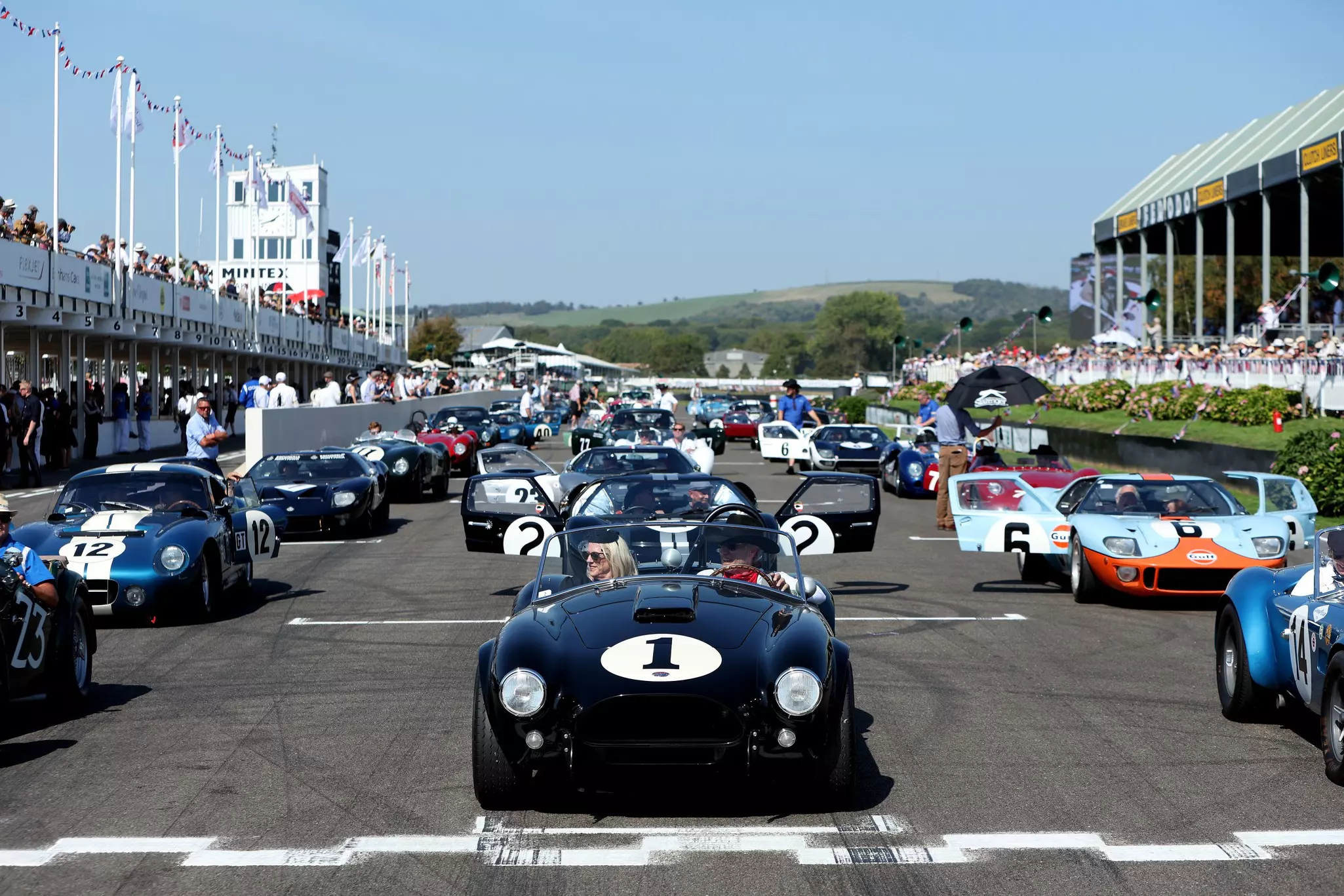 Drivers waiting to circle the track at the Goodwood Revival.