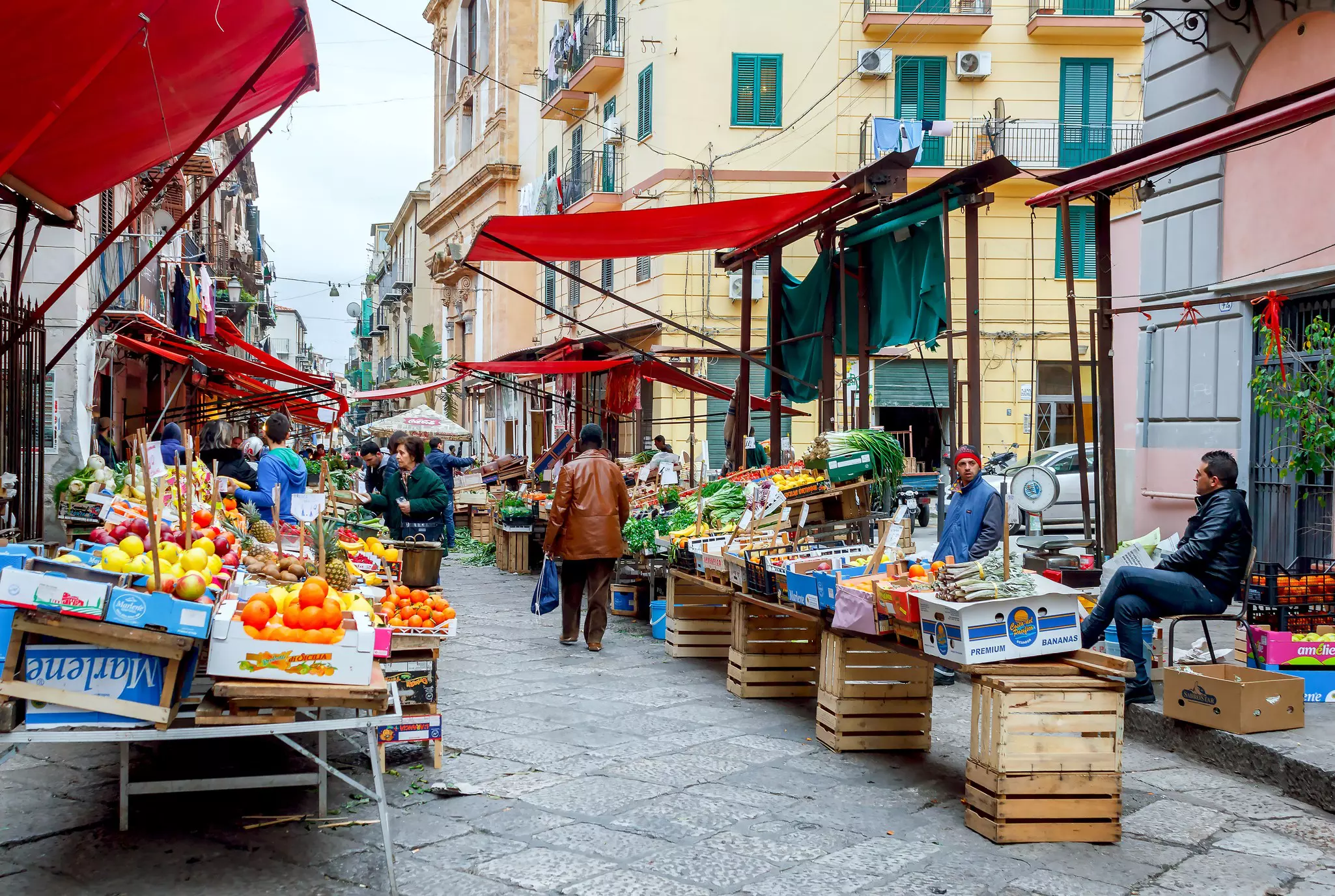 Busy local market in downtown Palermo of Sicily, Southern Italy.