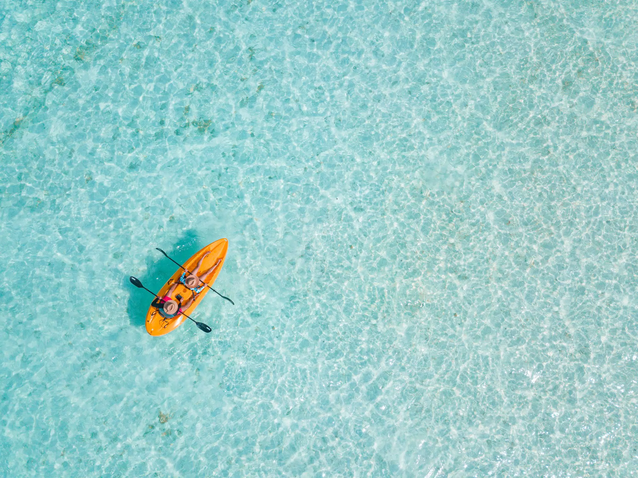Couple navigating in kayak the Bacalar Lagoon, near Cancun in Riviera Maya, Mexico