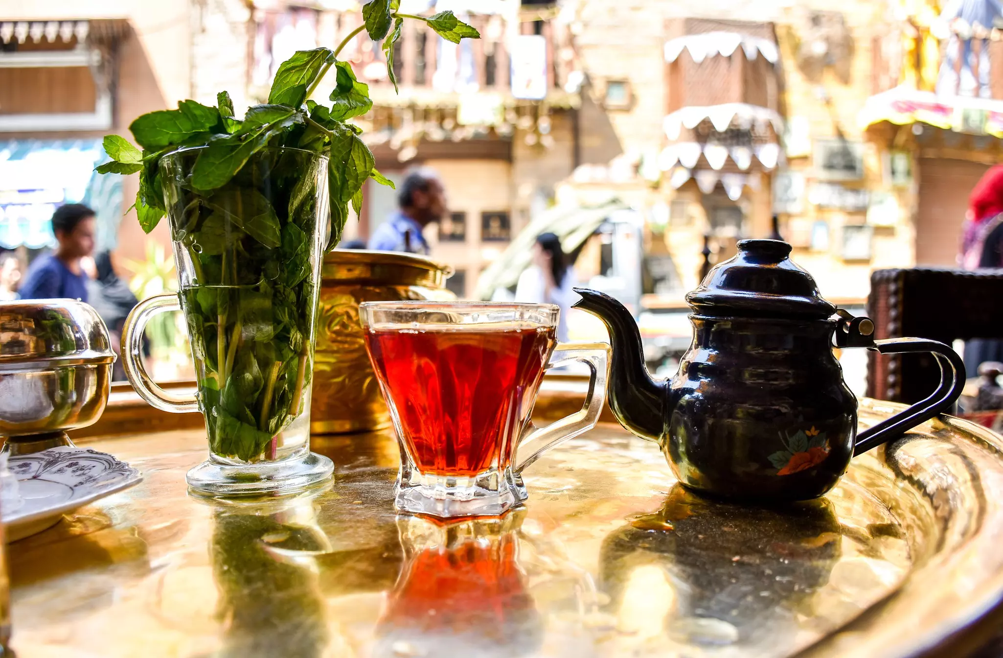 Egyptian tea, served in a glass, on a table in a roadside cafe in Egypt.