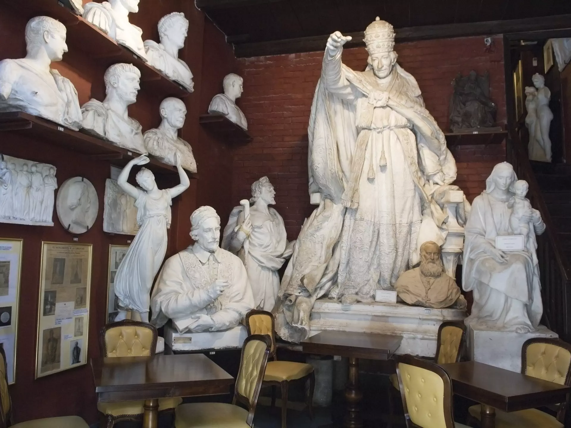 25779-99
Europe, Italy, Lazio, Rome, absence, arrangement, art, bust, cafe, ceramics, chair, collection, colour, culture, eating out, female likeness, food & drink, furniture, horizontal, human representation, indoors, large group of objects, male likeness, no people, order, sculpture, seat, shelf, statue, table, white
Museo-Atelier Canova-Tadolini sculptural studio and cafe, Tridente area.