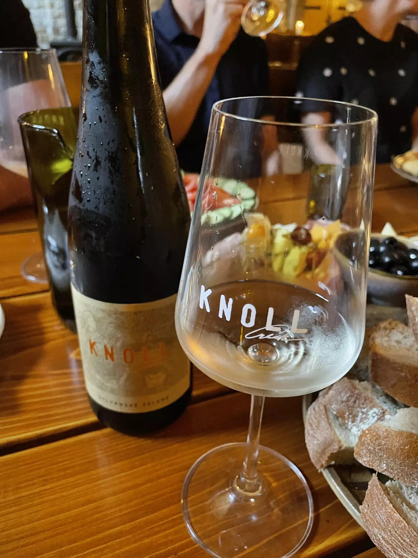 A wine bottle and galss at Winery Knoll, Velké Pavlovice, Moravia, Czechia