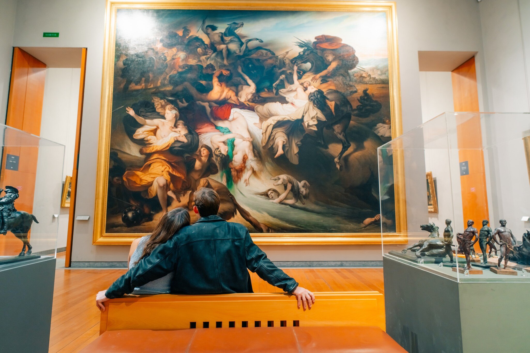 Interior photo of a couple sitting in Museum of Fine Arts Lyon, France.