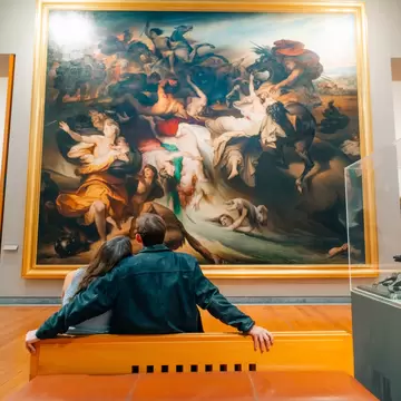 Interior photo of a couple sitting in Museum of Fine Arts Lyon, France.