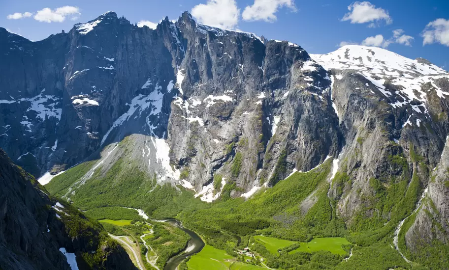 Rock face of the Trollveggen above lush green valleys.