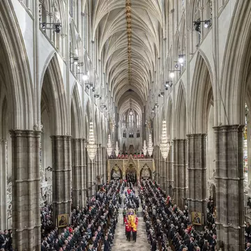 LONDON, ENGLAND - SEPTEMBER 19: King Charles III, the Queen Consort, the Princess Royal, Vice Admiral Sir Tim Laurence, the Duke of York, the Earl of Wessex, the Countess of Wessex, the Prince of Wales, the Princess of Wales, Prince George, Princess Charlotte, the Duke of Sussex, the Duchess of Sussex, Peter Phillips and the Earl of Snowdon follow behind the coffin of Queen Elizabeth II, draped in the Royal Standard with the Imperial State Crown and the Sovereign's orb and sceptre, as it is carried out of Westminster Abbey after her State Funeralon September 19, 2022 in London, England.  Elizabeth Alexandra Mary Windsor was born in Bruton Street, Mayfair, London on 21 April 1926. She married Prince Philip in 1947 and ascended the throne of the United Kingdom and Commonwealth on 6 February 1952 after the death of her Father, King George VI. Queen Elizabeth II died at Balmoral Castle in Scotland on September 8, 2022, and is succeeded by her eldest son, King Charles III. (Photo by Danny Lawson - WPA Pool/Getty Images)
1243370187