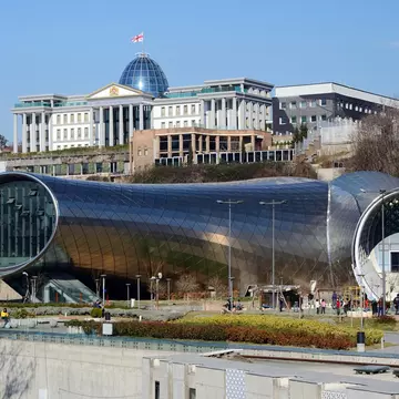 TBILISI, GEORGIA - MARCH 07, 2015: People in park in front of Concert Hall and  Official residence of Georgian President in Tbilisi, Georgia.Tbilisi is a capital and largest city ib country; 
Concert Hall & Exhibition Centre

Shutterstock ID 46237...