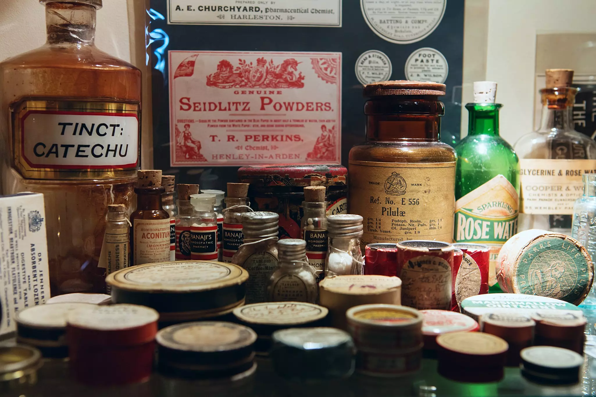 Old pill bottles and tins of ointment