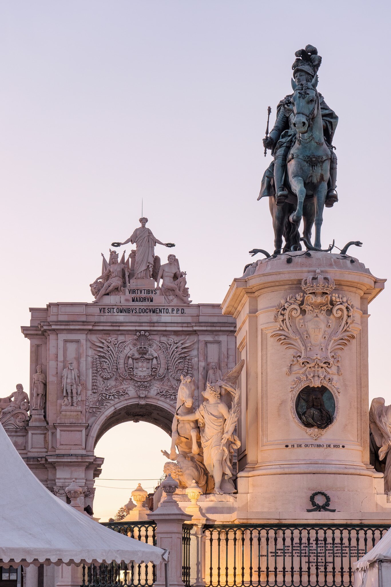 Historic statue of King José I on Praça do Comércio at dusk in the Commerce Square and Arco da Rua Augusta.