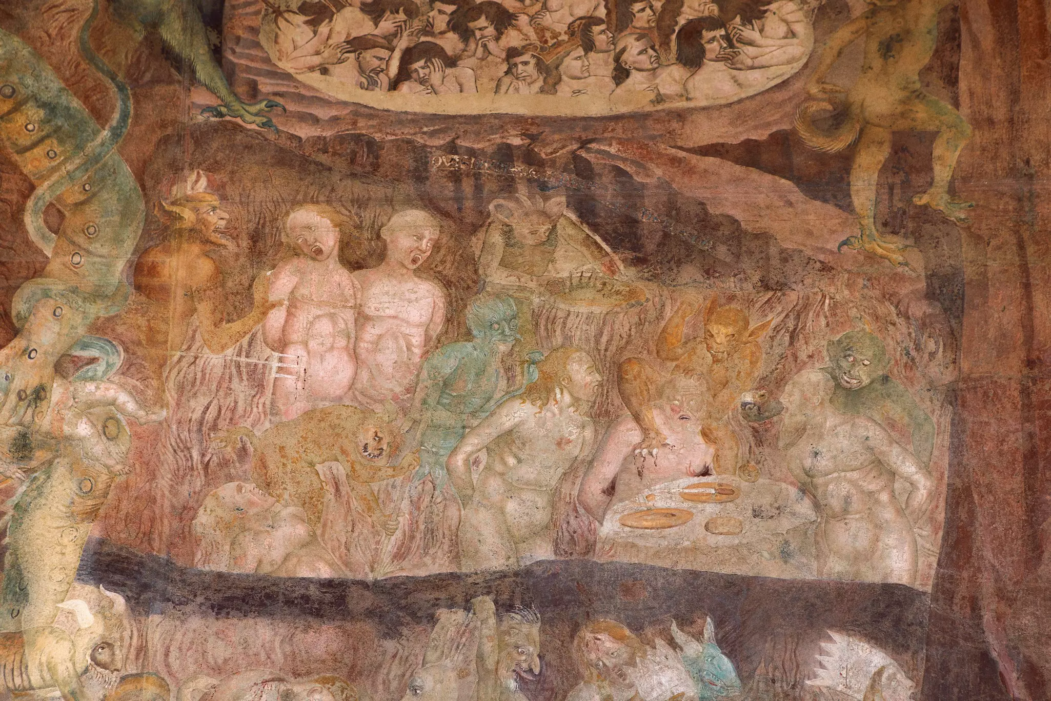 A scene of devils tormenting the damned on a restored fresco inside the Camposanto cemetery in Pisa, Tuscany, Italy.