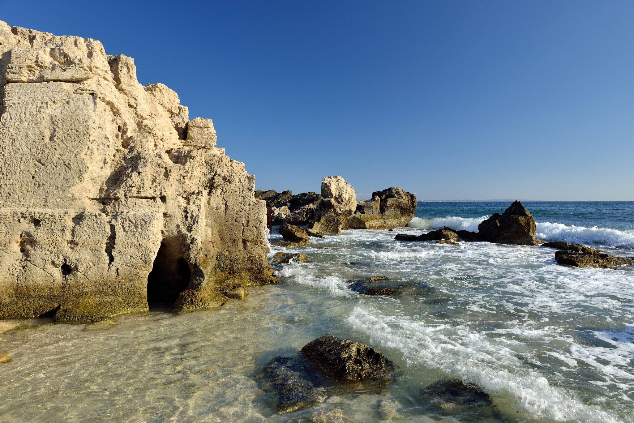 Stone beach Salines on Ibiza. Balearic Islands. Spain; Shutterstock ID 1387168433; your: Sloane Tucker; gl: 65050; netsuite: Online Editorial; full: POI