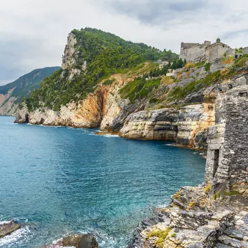 Cliff sea coast with Grotta di Lord Byron in Portovenere or Porto Venere town on Ligurian coast. Province of La Spezia. Italy