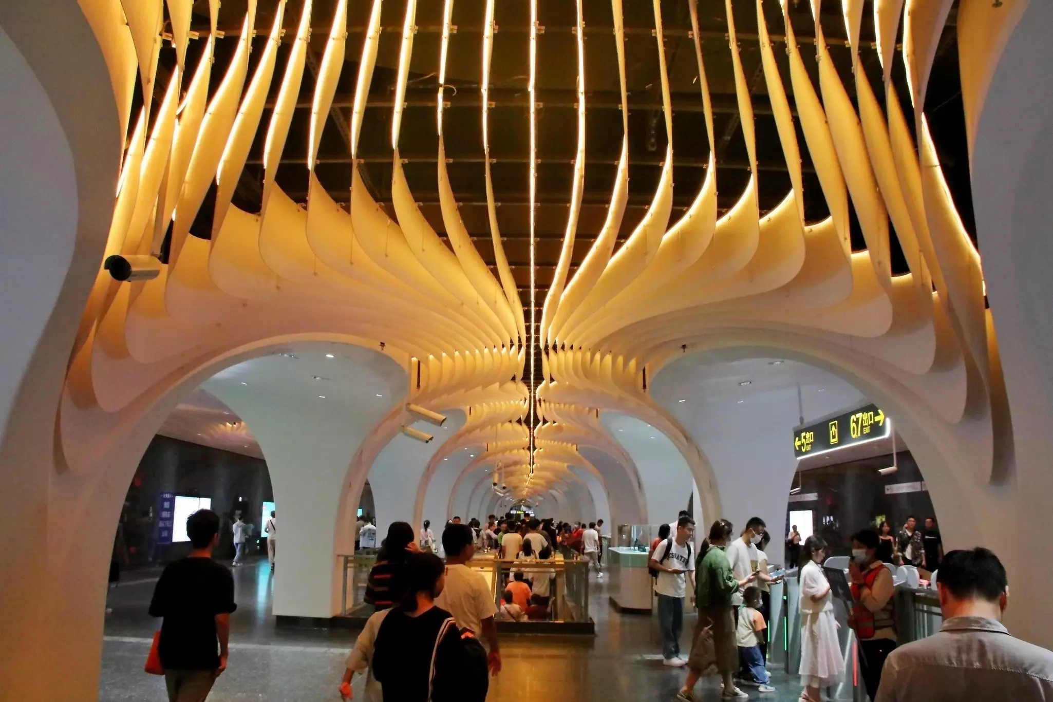 The interior of a busy Shanghai metro station