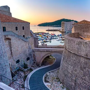 Dubrovnik's city walls and harbor. kavalenkava/Shutterstock