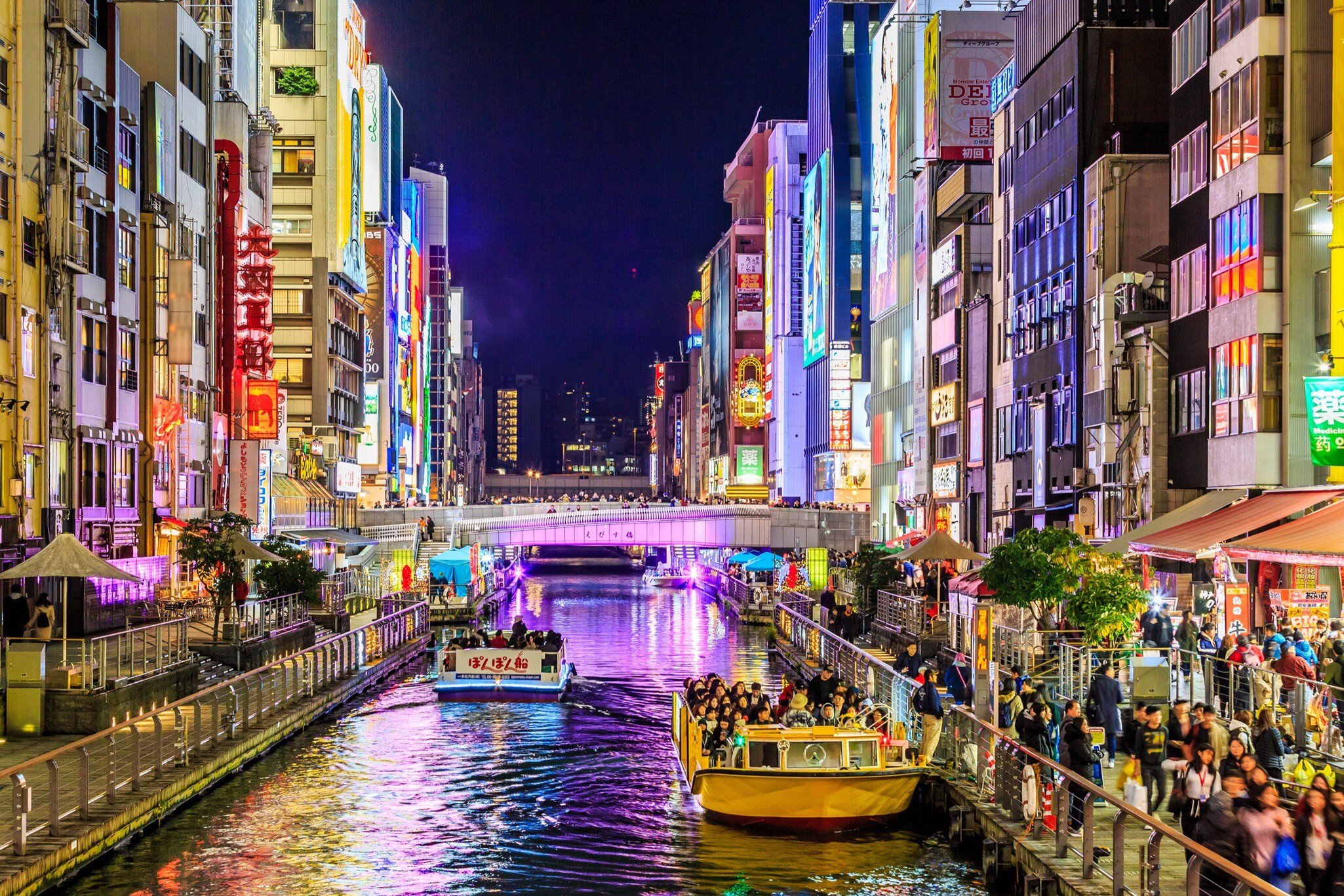 Osaka, Japan-November 21, 2017 : Tourist walking in night shopping street at Dotonbori or Dotomburi, Dotonbori the famous destination for traveller in Shinsaibashi, Osaka City, Namba, Osaka, Japan.; Shutterstock ID 760293580; your: Ben Buckner; gl...