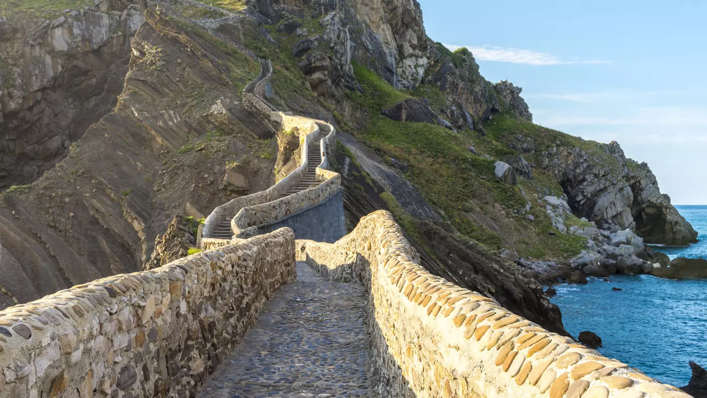 View of the man-made path leading up to the hermitage on the islet of San Juan de Gaztelugatxe in Spain.