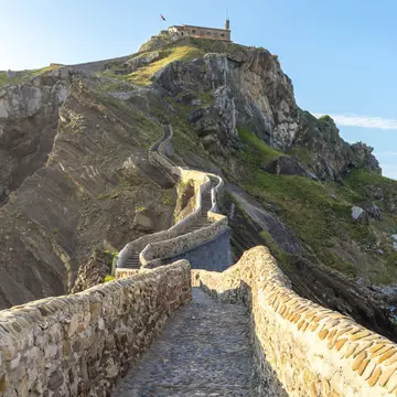View of the man-made path leading up to the hermitage on the islet of San Juan de Gaztelugatxe in Spain.