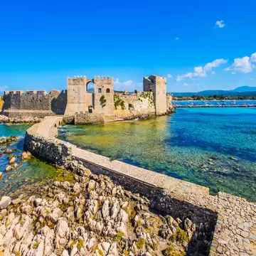 Venetian fort castle Methoni. Beautiful seaside resort in Greece Mediterranean. Blue warm sea water is great for swimming. The concept of active, phototourism and beach holiday ; Shutterstock ID 1439695043;
