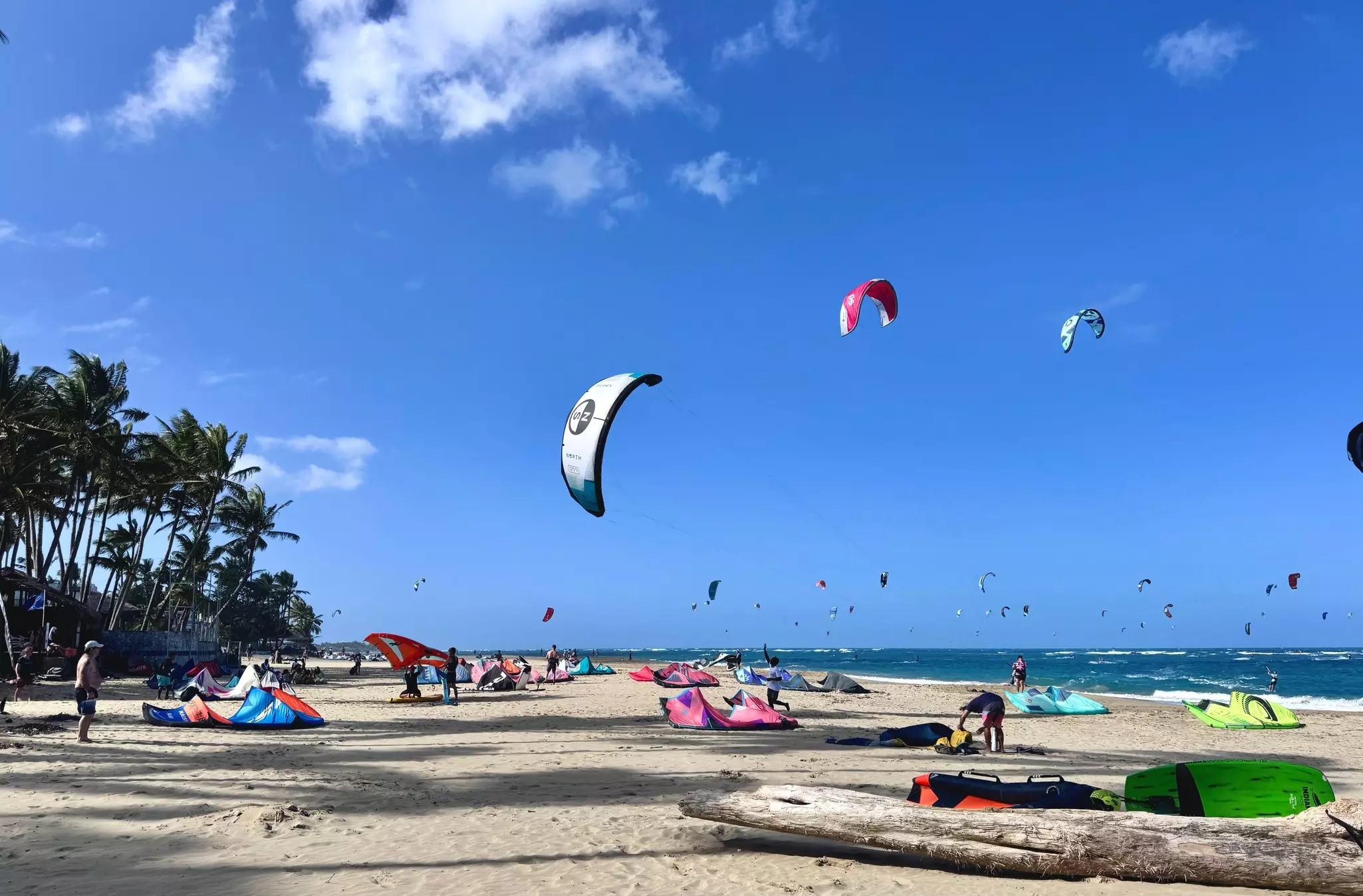Kites and kiteboarders on Kite Beach in Cabarete, Dominican Republic