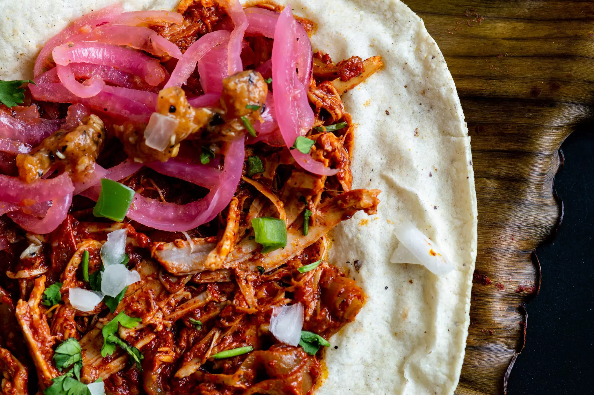 Mexican Tacos of Cochinita Pibil, pit-roasted marinated pork.