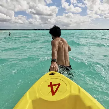 A kayaker in Laguna Bacalar. Ghecipol/Shutterstock