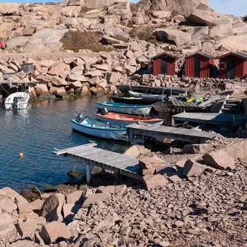 Lysekil, Sweden - Aug 17, 2025: Small boat harbour with red wooden huts and moored boats among granite rocks in Stångehuvud nature reserve, Lysekil, Bohuslän, west coast Sweden, License Type: media, Download Time: 2026-06-04T18:31:17.000Z, User: LP_NZhan, Editorial: true, purchase_order: 65050 - Digital Destinations and Articles, job: App Content, client: Lonely Planet, other: Nadine Zhan