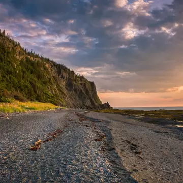 View of a beach in Bic National Park during sunset in Canada.