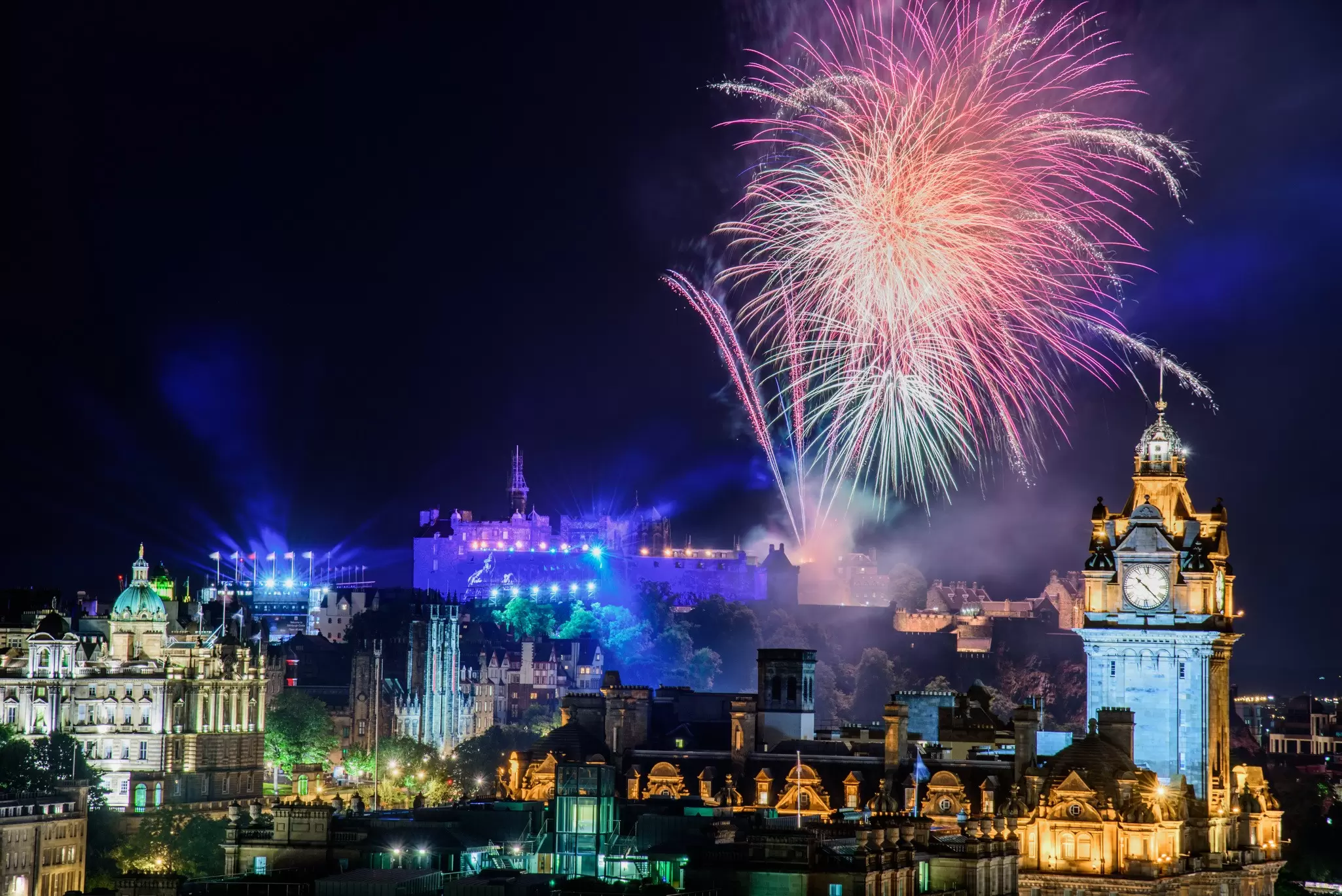 Summer fireworks lighting up the skyline over Edinburgh, Scotland