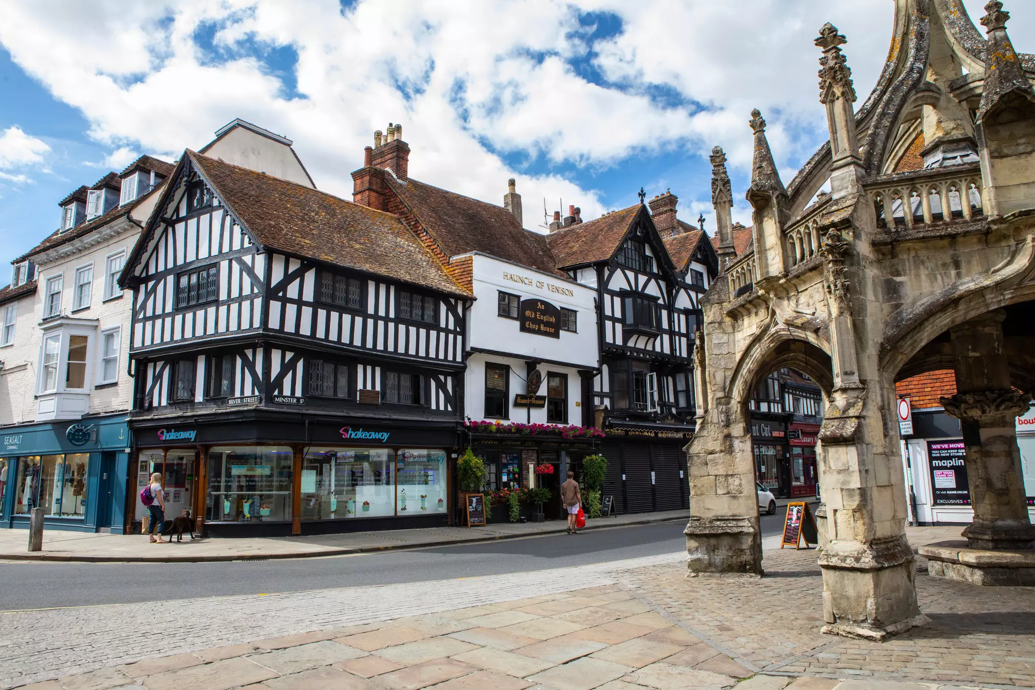 A beautful Tudor era timber-framed building and the Poultry Cross in the city of Salisbury in the UK.